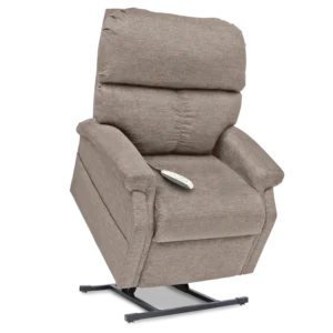 A beige recliner with remote control on it.